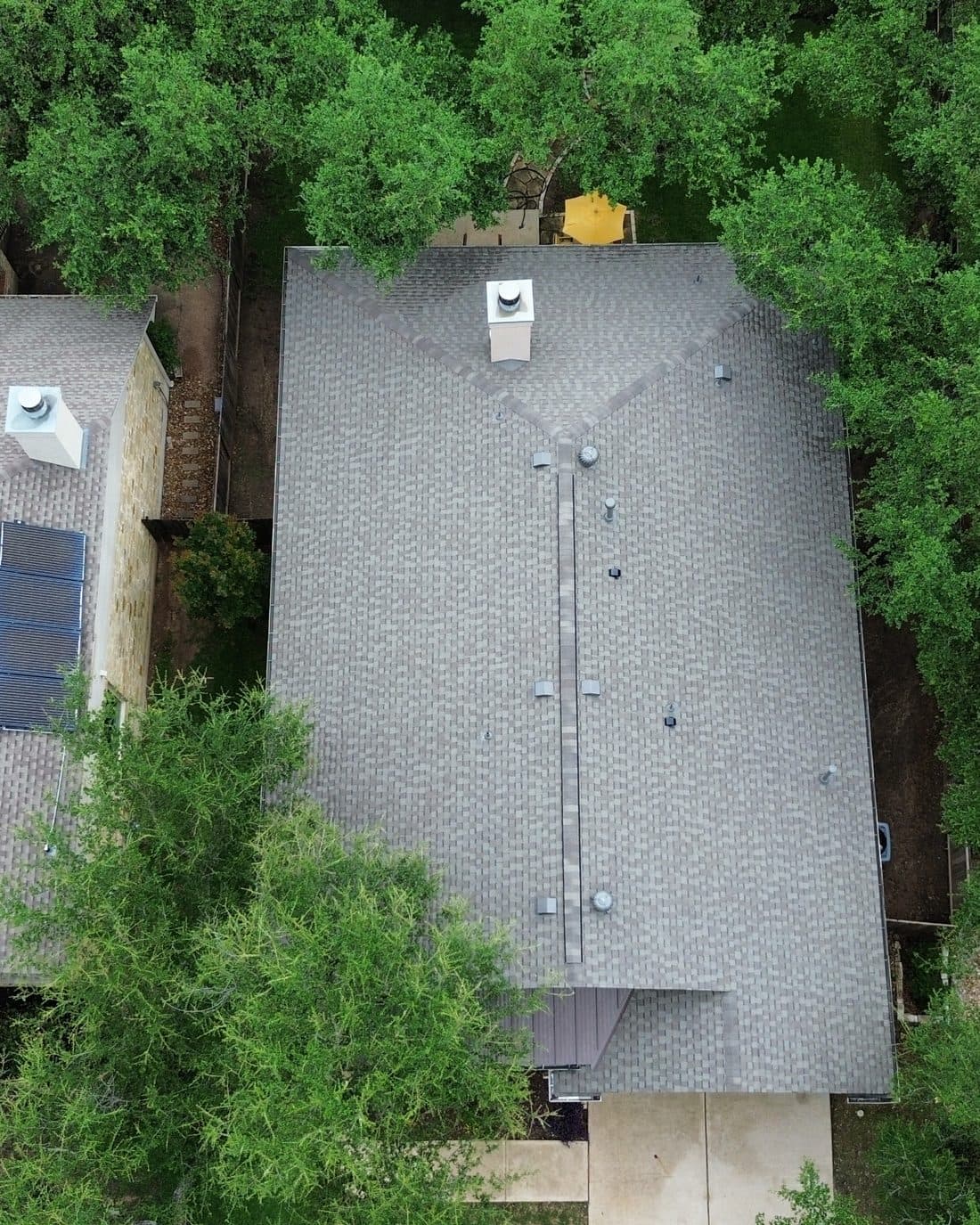 Roof Replacement Austin TX | Architectural Shingle Roofing Contractor Roof replacement Austin TX, aerial view of a new architectural asphalt shingle roof installed by Helix Roofing LLC, residential roofing contractor in Austin Texas